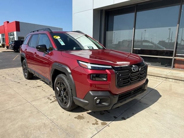 2026 Subaru OUTBACK Limited in Crimson Red Pearl — front three-quarter view